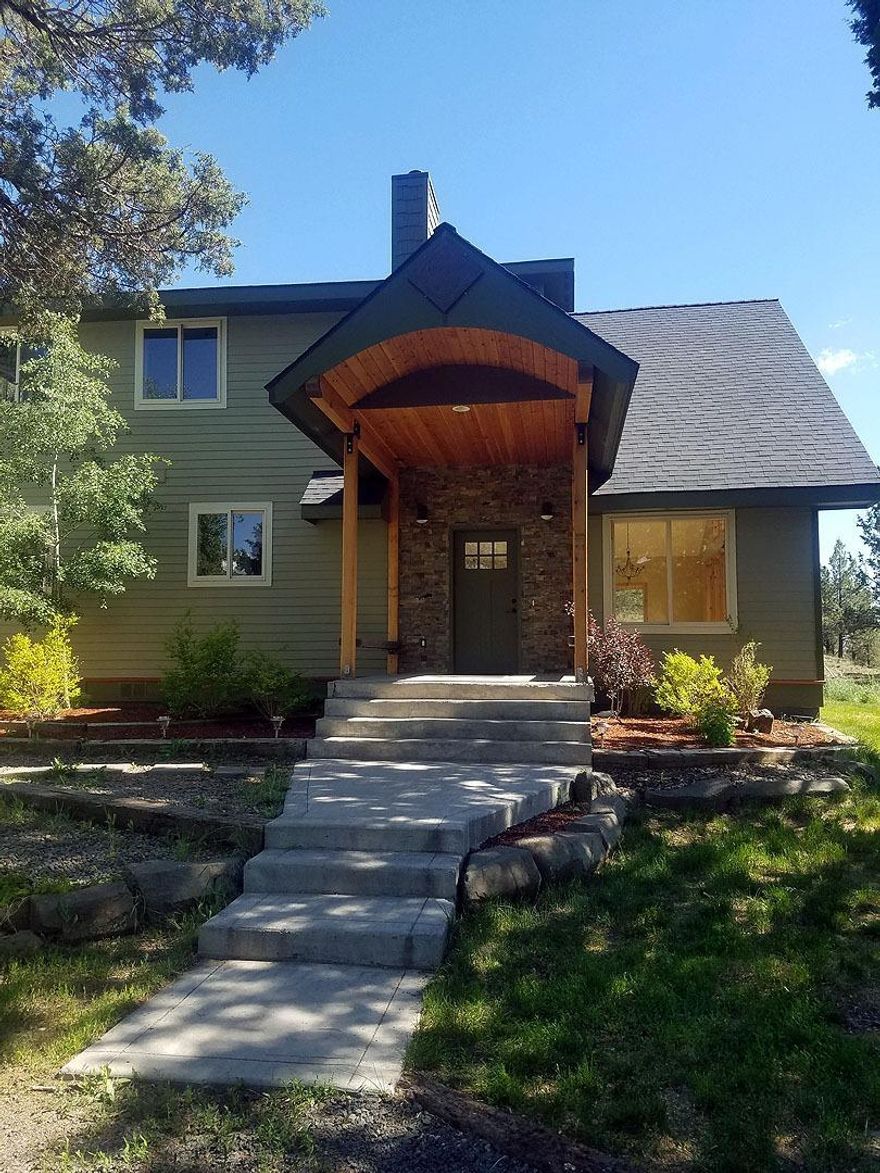 Custom built home on 8 acres overlooking the scenic Lost River. Enjoy life in the country with only a short remarkably scenic drive to town. The arched front porch is covered & features enclosed soffit, two benchs & stonework surrounding your entry to this with home with 4 spacious bedrooms, 2 full baths, a large laundryroom/mudroom, new appliances & central vacuum. This home features a kitchen designed for family & entertaining, with granite tile countertops, hand pounded copper sinks. Large open living area that is tastefully trimmed with wood & copper. Vaulted ceiling, & panoramic windows allow natural light to abound, & the views down the Lost River & Langell Valley are truly peaceful, from inside or out on your deck. The Three car detached garage has extra storage space/work room. Even the chicken coop has a river view. Bus stops in front, and can also be Henley!