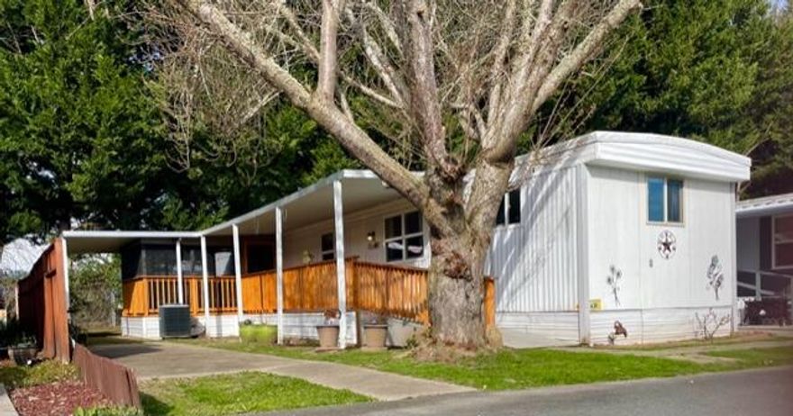 Wow!  This dollhouse steps to river is only $22,000!   AND Seller will pay two months space rent for qualified buyer.   Cute and cozy home with some fantastic features.   Move in ready! and well maintained home has new electrical panel, toilet,  reglazed tub, faucets, plumbing, shut-off valve, cedar deck and front entry with screened in porch / patio room for you or your fur babies to relax and enjoy fresh air; electric fireplace and new heat pump and roof. 
New 6x8 Tuff-Shed included. 
Senior (55+) park with many amenities including clubhouse, BBQ/patio area, laundry plus steps to river park with deck overlooking the Rogue River and river access. RV rental parking storage available. Up to two small pets (under 40lbs) welcome!