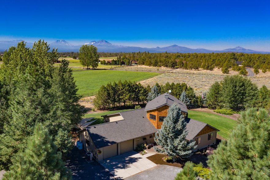 Imagine a home in Central Oregon with Cascade mountain views and seasonal lake views!  This is a must see, over 8 acres in beautiful Sisters Oregon.  Established neighborhood with horses and hay.  This beautiful home was updated by designer/contractor owners for their personal home.  If your looking for fresh aquifer well, love to garden & want your own fresh eggs...take a look. Property is located next to McKenzie Canyon Reservoir which provides abundant wild life along with privacy and serenity.  This special home has so much to offer; could be a wonderful horse property, or build that shop you always wanted.  Patios, water features, large Fenced garden, chicken coop and run.  Great space for studio or office. Dream your own dream!  New roof, new pump, new stone gas fireplace & new granite counter tops in Kitchen.  All new wood, tile & carpet flooring.  New paint inside/out. New trim, interior doors and hardware.  New Master bath and half bath.  Come visit this wonderful home.