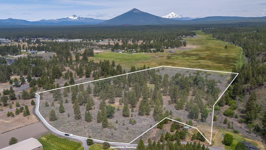 Exceptional 25-acre estate with picturesque mountain views and meadow setting, just minutes from downtown Sisters. This property features a 3 bed/2.5 bath home with a generously sized kitchen and sturdy construction, awaiting your personal updates. Additionally, attached 2-car garage with pull-through design and spacious room above offers endless possibilities for a studio, office, or separate living space. Highlighting the property is a massive shop with separate metered power, 48x72 uninsulated portion with 4 bay doors, and a 12-foot garage door opening to an insulated 48x24 bay equipped with hot & cold running water. Equestrian amenities include a 6-stall barn complete with a hayloft, heated tack room, and hot/cold running water. The entire property is cross-fenced with additional horse shelters for convenient feed/ tack storage. Under 5 minutes from downtown Sisters, this property offers a perfect blend of rural tranquility and urban convenience, the last of its size and proximity