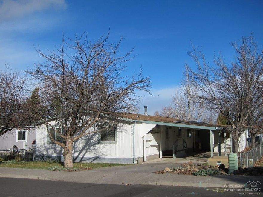 This home lives large with its vaulted ceilings & open floor plan. Large kitchen with lots of counter space opens to the living room & the dining area with a built in cabinet. Master, with walk-in closet, & secondary bedrooms at opposite ends of house. 4th bedroom could be a big office with its double doors. Fenced yard with shed plus an insulated shop/storage with power off the double carport. Recent upgrades to this home include newer windows, some flooring & tub/shower in the master. Very clean & tidy.