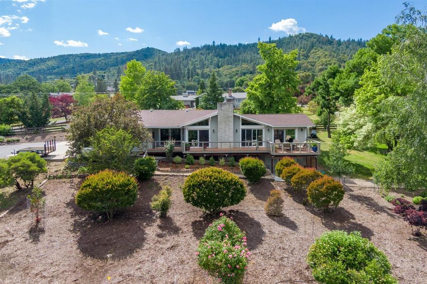 You will feel immediately at home in this completely remodeled one level home in a desirable location in the West Hills just outside Jacksonville. The home features main floor living w/ an open concept floorplan, vaulted ceilings & walls of windows w/ beautiful Mt. McLoughlin and valley views. The kitchen has stainless appliances, custom cabinetry & granite countertops, a bar open to the living area, & views of the beautiful trees in the backyard. The master is spacious w/ a walk in closet & a spa bath w/ a huge shower & the convenience of the laundry room off the master bath. Downstairs offers a den/office w/ extra storage & a sliding door leading to a private patio. The outside is designed for entertaining w/ patio & deck areas on 3 sides of the park-like one-acre property that provides separate seating areas. The backyard features a detached shed w/ electrical & room for a shop or a pool.