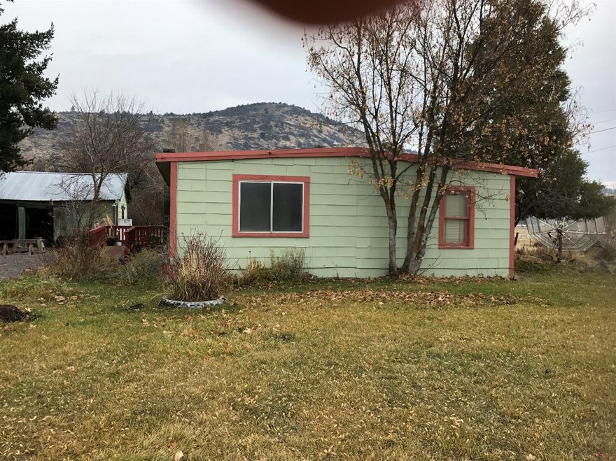 Fixer Upper, Bring your tools, bring your imagination and come see this home. Acreage and a corner lot with a view of the mountains. This three bedroom home is ready for you to fix up.