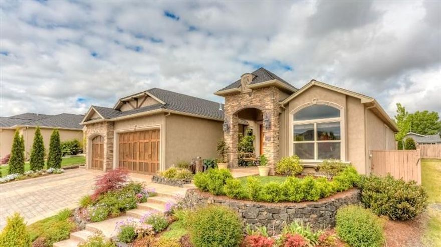 This spectacular Pagnini built home is a work of art. The 2518 sq/ft single level home has an open floor plan with 3 bdrms, 2 1/ 2 baths, fully paneled office w/ pocket doors, dining area with wood and travertine flooring & coffered ceiling, arched hallways, and a great room with vaulted ceiling. Large eat-in kitchen with a 6 burner Pertazzoni cooktop, double wall ovens, built in microwave, skylight, oversized center island, granite counters, and floor to ceiling custom cabinetry. Master bedroom suite has it all. Separated from the other 2 bedrooms, it has coved ceilings with French doors, & a master bath with jetted tub, granite counters, travertine shower with glass tile and glass doors and walk-in closet with built storage. Living room with fireplace & glass tile surround, floor to ceiling custom built-ins, & windows that look out on the landscaped fenced back yard and covered patio with an out-door kitchen with Wolf barbeque, sink, refrigerator and abundant storage & counter space.