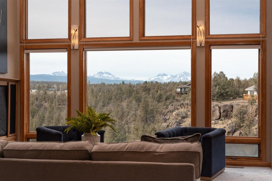 The sights and sounds of nature surround you on your private 1.42 acre sanctuary perched atop the Deschutes River with sprawling Cascade Mountain and river views. Offering a PRIME location in the heart of Tumalo, with convenient access to Bend. The minute you walk through the front door, you are greeted with a breathtaking view of the mountains. Designed to live in harmony with nature and the surrounding wildlife, the home boasts FIVE low-maintenance Timber Tech DECKS. This three level home offers four bedrooms, each with an ensuite bathroom and it's own private deck, and provides you with the highest level of flexibility and functionality. Private trail gives you access to the river for unlimited fly-fishing and water adventures. There is plenty of room to store all your toys in the detached, HEATED 3-car garage PLUS a separate storage building that includes additional 1-car garage bay, both with oversized, overhead storage. Property includes 1 acre Swalley Irrigation.