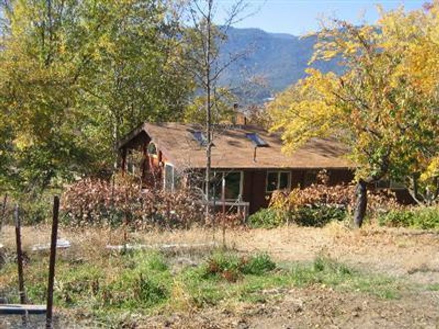 The Perfect Country Set-up! Fabulous Mountain views on almost 40 acres in the Williams Valley. Private setting but only minutes to town. Set-up for animals with fence and cross-fencing, barn and almost 20 acres in open pasture. Seasonal creek and pond. Large fenced organic garden and orchard with Apples, Pears, Figs and Grapes. Easy access to BLM for endless riding and hiking. Red Cedar Notched timber dwellling was completely remodeled in 2005 using green products to reduce chemical off-gassing. Add on to existing dwelling or start your dream home from scratch.
