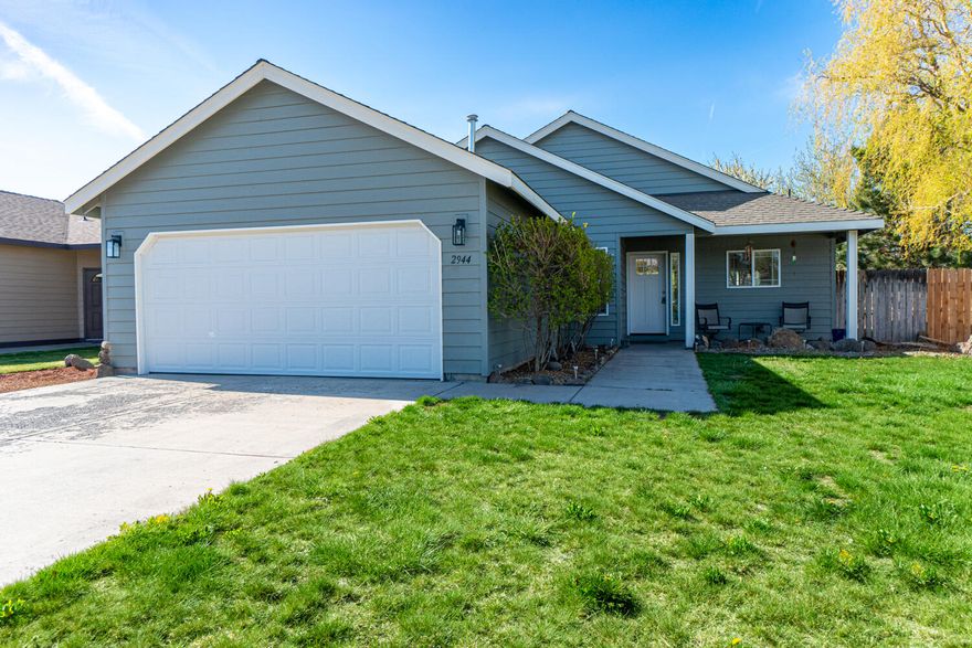 Located in a quiet SW Redmond neighborhood just minutes from Umatilla Sports Complex & Hayden or Luna Park. Easy access to Hwy 97 & Rdm airport. Tiled entryway leads to a vaulted great room floorplan w/brand new wood look laminate flooring throughout main living area plus bedrooms w/ new paint as well. Kitchen ftrs breakfast bar, an abundance of upper & lower cabinetry, backsplash, & Stainless Steel appliances are included. Right off the main living area is a set of sliding glass doors that lead to the backyard & patio. Plenty of windows bring in a ton of natural lighting throughout the home. Primary bedroom  w/ large walk-in closet. Two additional bedrooms share a full bath. Fully fenced & landscaped w/ covered front patio & sprinklers in front. Backyard has firepit area & is a blank slate for your own imagination.