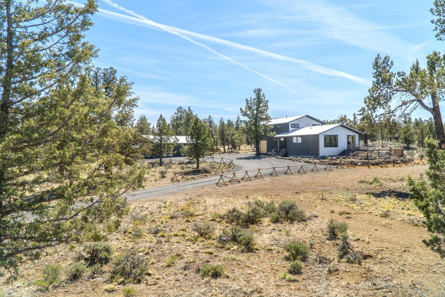 A rare opportunity to own a newly constructed home with stunning Cascade Mountain views! Enjoy a clean & modern designed home with warmth & natural light in every space. Rich hardwood floors, oak cabinetry & soapstone surfaces allow for ultimate elegance. The spacious kitchen is a chef's dream with designer ILVE oven/range, copper sink, large refrigerator/freezer & drink cooler. The wood burning stove can be enjoyed from the living room overlooking the property & the westerly mountain views. The master is on the main level with a large walk-in closet & spa-like bathroom. The upper level offers stunning cascade views, 3 additional bedrooms, a full bathroom with tub and spacious living area. There is an attached oversized 1 car garage with tall doors as well as a detached multi-purpose building perfect for a shop or vehicles. This property provides you the space & lifestyle that Central Oregon offers. 25min drive to either Bend or Redmond & 12min to Sisters! Come see this beauty today!