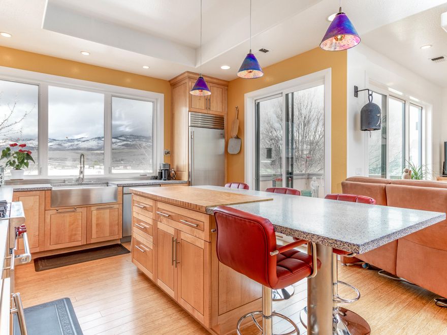 Beautifully appointed condo blocks away from the heart of Ashland. Enjoy the gourmet kitchen that includes a Sub-Zero refrigerator, Wolf range, wine refrigerator, beautiful concrete counters inlaid with glass and, custom cabinetry.  This unit faces Grizzly Peak and is full of natural light throughout the space. Two bedrooms/2 baths offer plenty of space.  A patio off the kitchen and living room extend the living space with built-in gas for outdoor grilling and entertaining. This is a secure building with a gated entry for the living areas and a gated garage in the basement. The association pays for exterior landscaping and maintenance.  This home is truly easy living and move -in ready!