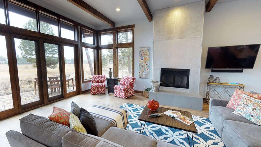 Located in the exclusive Caldera Springs community, 56976 Dancing Rock Loop is the perfect basecamp for exploring Sunriver and beyond. This 2,580 sq. ft. home has 3 bedrooms and 3.5 bathrooms, making it enjoyable for up to 8 guests. Inside this luxurious, contemporary home, you will find spacious kitchen, living, and dining areas with beautiful hardwood floors,  tall ceilings, wood accents, and large windows to take in the surrounding views of the Caldera Links Course and natural landscape.