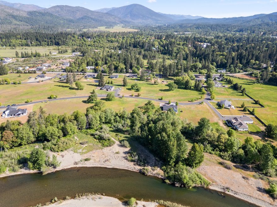 Bring your builder and build your dream home on this level usable .85-acre lot. The lot is in one of the Illinois Valley's premier gated communities with river access and amazing views of the surrounding mountains. All city services are located at the street for easy hookup. Call to set up your showing today! Lot lines on photos are approximate. Buyer to do their own due diligence regarding all aspects and uses of property.