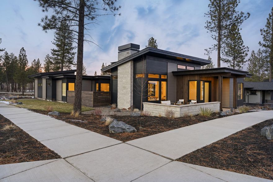 Experience modern luxury in this stunning 4-bedroom, 3.5-bath, 3,240 sq. ft. two-story residence by Luxe Homes. Designed for both elegance and versatility, the home features a dedicated living wing with full bath, kitchenette, and laundry—ideal for guests or multigenerational living. The open-concept main level seamlessly connects the living, dining, and kitchen spaces, complemented by a private office and a serene, luxurious primary suite. Upstairs, a bonus room provides flexible entertainment or leisure space. Contemporary finishes throughout and thoughtful design elevate every room, while a three-car garage with a sprinter bay ensures ample storage. Two beautifully appointed courtyards/patios create perfect spots for relaxation or entertaining. A sophisticated, functional haven built for modern living in Discovery West. Builder is in the process of extending the fence to encompass the side yard.