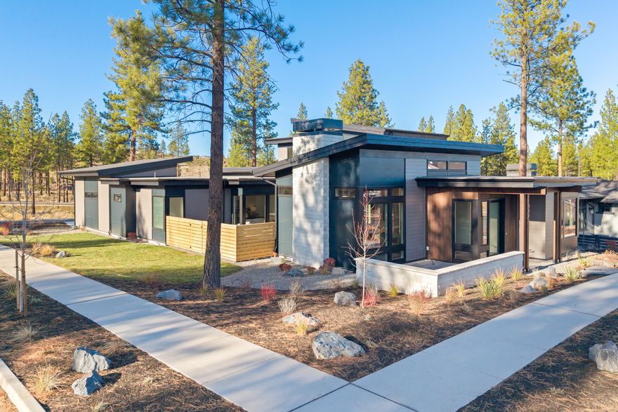 Experience modern luxury in this stunning 4-bedroom, 3.5-bath, 3,240 sq. ft. two-story residence by Luxe Homes. Designed for both elegance and versatility, the home features a dedicated living wing with full bath, kitchenette, and laundry—ideal for guests or multigenerational living. The open-concept main level seamlessly connects the living, dining, and kitchen spaces, complemented by a private office and a serene, luxurious primary suite. Upstairs, a bonus room provides flexible entertainment or leisure space. Contemporary finishes throughout and thoughtful design elevate every room, while a three-car garage with a sprinter bay ensures ample storage. Two beautifully appointed courtyards/patios create perfect spots for relaxation or entertaining. A sophisticated, functional haven built for modern living in Discovery West.