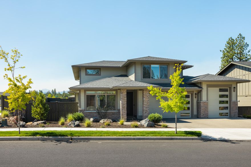 Beautiful River Vale home features Cascaded Mountain views, a warm, open floorplan with a modern kitchen with island, quartz counters, upgraded appliances, an oversized pantry, and master on the main. The downstairs master features a huge tile shower, separate soaking tub, double vanity, and walk in closet, and patio access just steps to the hot tub. If you work from home you'll love the downstairs office with separation from the other rooms to work in peace. Upstairs features an oversized media room, huge secondary bedrooms with walk-in closets and an upgraded bathroom. The spacious 3 car garage with 10' door on 3rd bay, has tons of room for all your vehicles and toys. Laundry room features a sink and cabinets for extra storage. This corner lot features a fully fenced backyard, covered patio perfect for entertaining, a well-manicured lawn, and a hot tub for relaxing.