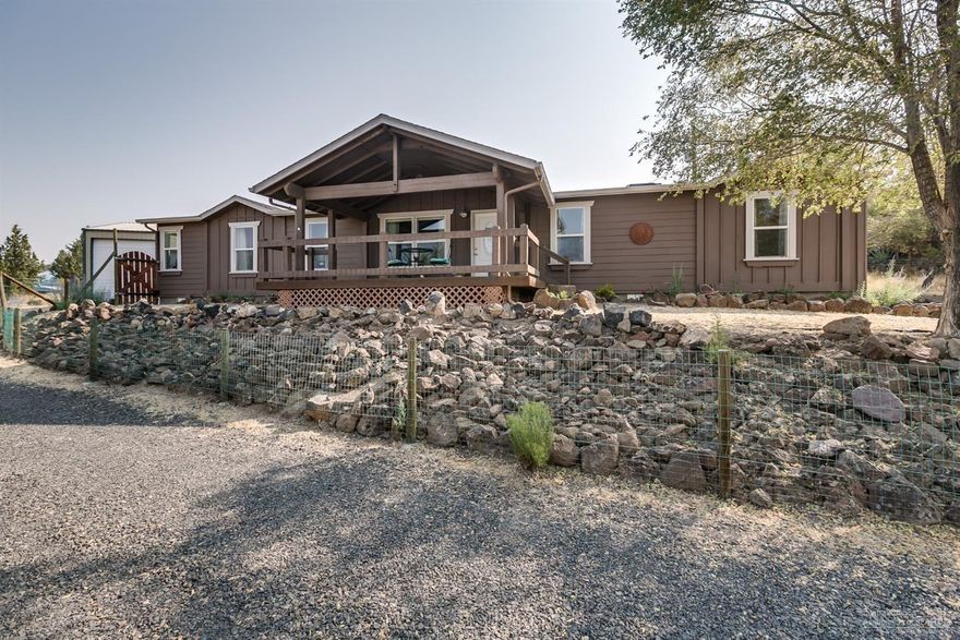 Fabulous views of Cascade Mts from this beautiful 2200SF, 3-bed, 2-bath, single level home. Large living spaces incl. living & family rooms, formal/informal dining & exceptionally large kitchen w/island, pantry & storage galore. A Flex room offers option of 4th bedroom or office! Enjoy stunning sunsets from front covered deck or sip a cool drink in the afternoon shade of the spacious rear deck. 1080SF garage offers 2-bays plus large shop & mezzanine strg. Paved road, Asphalt drive & lrg fenced pet-pen