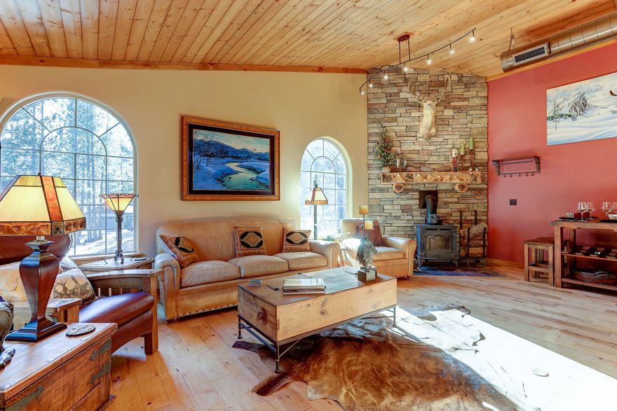 This custom mountain home is an outdoor paradise. The original structure features beautifully hand-scribed, notched, and hand-hewn logs. Inside, an open floor plan and vaulted ceilings welcome you. The main-level master suite offers a soaking tub, heated floors, dual sinks, tiled shower, and walk-in closet. Upstairs is a bonus loft and a private guest bed/bath. The kitchen has a large island and opens to the great room. The attached addition includes another great room, space for a pool table, 2 bedrooms, office, full bath, private entrance with outdoor stairwell, and locked access to the main home. A large deck offers backyard views. The large laundry room has an indoor horse wash. Room for 5 cars and RV parking. The private backyard has Trex decking, a water feature, horse corral, and barn. Deschutes NF is out front; Mt. Bachelor is 20 min away, with golf, fly fishing, and Sunriver dining nearby. Adjacent parcel also for sale.