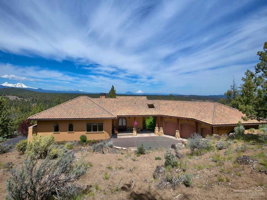Own this spectacular 10 mountain Cascade view home on one acre in prestigious North Rim. Minutes from downtown, yet private, high-end quality and single level. The office could easily be made into a third bedroom. The master suite is out of this world, and the guest room is amazing. Main level 3-car garage plus a lower level single, expansive paverstone decks, incredible outdoor entertaining options, and the list goes on. Access to the Deschutes River Trail, tennis courts and park are all part of North Rim.