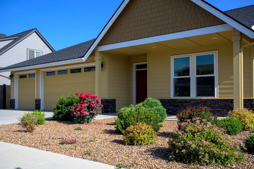 FIRST TIME ON THE MARKET! This gently lived-in 4 Bedroom home has an open floor featuring solid surface flooring throughout the traffic areas. The Kitchen features  gently used appliances and Quartz Countertops 
and custom tile backsplash. The large kitchen island is a perfect area to gather with friends and family. Gas Fireplace features stacked stone accents. Two patio doors lead to an extensive concrete patio with raised flower beds bordering the yard. The perfect mix of low maintenance and beautiful perennial flowers. Nice, raised garden area and garden shed at the back of the home. Fully fenced and very private in the back yard. This home is Move in Ready. 3 Car Garage was built with a 4' extension and is nicely finished. Sink and cabinets in the garage as well.