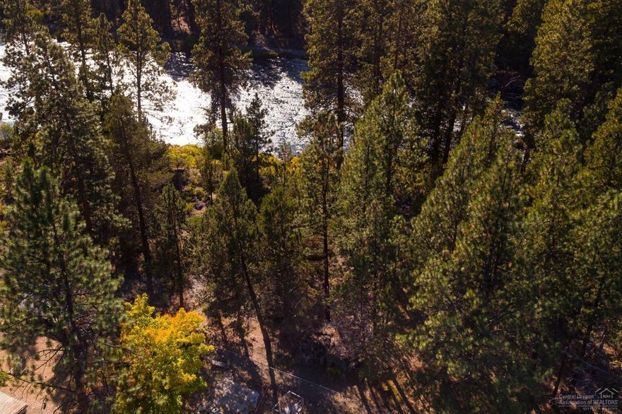 River views, prime location and gorgeous mature trees combine to make this a one of a kind opportunity to build your dream home in the heart of Bend. Experience the unrivaled convenience and natural beauty of Woodriver Village, only 1 mile from the Old Mill District.This beautiful lot backs up to the Deschutes river trail which meanders along the river leading to Farewell Bend Park,the Amphitheater,the Old Mill and endless dining, shopping and entertainment opportunities. If you want the convenience of urban Bend combined with the forested terrain that makes this area so special, this river view property adjacent to park land is the answer. Buyer to do due diligence on development potential with the City of Bend. Check out the video!