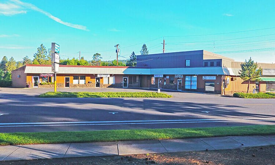 This is a once in a lifetime opportunity to acquire a large strategic property in the heart of downtown Bend. The site is in the path of progress in one of the most dynamic lifestyle markets in the USA. It has a great central location, is very close to the Deschutes River, and has great access to Highway 97. The property consists of two buildings and four tax lots with plenty of on-site parking.
The property is zoned Limited Commercial (CL). This zoning permits a wide range of uses including residential as part of a mixed-use development as well as retail, office, restaurant and lodging. There are currently nine tenants in the two buildings. All tenants are currently on month-to-month leases. An owner user has the ability to take over all the spaces in both buildings while the investor has the ability to improve the spaces and bring rents up to market. A full offering memorandum with financial information is available with a signed nda.