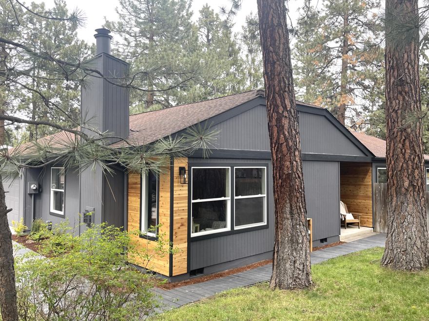 Nestled within the pine trees this newly updated SW gem is just waiting for it's new owners.  The one level 1632 square foot home has brand new LVP flooring, 3 bedrooms, 2 full bathrooms with tile showers and new vanities, a separate flex space and large enviable laundry room.  In the kitchen, stainless steel appliances, granite countertops, tile backsplash and a large island perfect for family gatherings.  The new deck in the back leads to a nice large yard with the canopy of Bend's favorite pine trees. This large 1/3 of acre lot, with RV parking, gives you all the elbow room along with a quiet neighborhood, close to all the Bend amenities. Come check it out today!