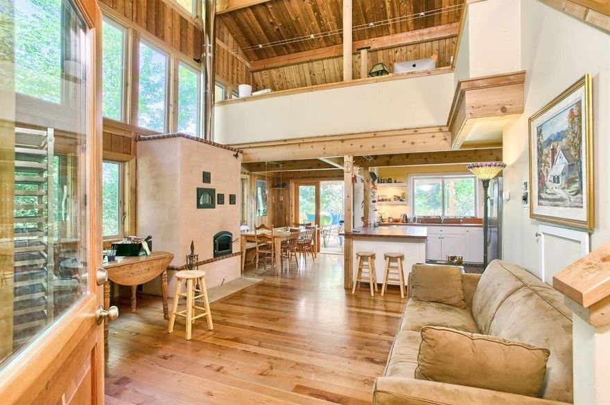 Enjoy the quiet private rural setting in the south end of Ashland close to Emigrant Lake this lovely peaceful setting offers 2 newer constructed homes designed by award winning architect Carlos Delgado. The open kitchen offers Madrone counter tops, gas range & abundant island storage. The living area is warmed by a Kachleofen masonry stove.The open staircase leads to a large office study area that is connected to the Master bedroom and bath. The second home is 1 bedroom with open kitchen and living area. Outside 10 acres with arboretum landscape fully fenced with gravity fed irrigation system, solar panels to assist in lowering Power cost. A peaceful flowing creek divides garden area from the orchard area, This unique property offers a permitted commercial kitchen with open area for many uses and separate full bath.