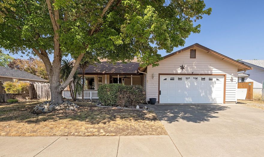 Welcome home! Walk into this move-in ready 3 bed, 2 bath home on a large lot with an open floorplan and vaulted ceilings in the living and dining rooms. Covered front patio with ceiling fan to enjoy your morning coffee. Built in 1994 and offering 1,573 sq ft of light-filled space with large windows throughout. Enjoy new flooring in the kitchen and dining area, a dedicated laundry room, and ceiling fans for year-round comfort. The generous primary suite features a newly upgraded bath with tile shower, new vanity, flooring, and direct access to backyard deck. Spacious guest bedrooms are flanked by a full guest bath. Entertain with ease on the enormous deck just off the dining room. Low-maintenance yard with large shed for storage. Quiet, centrally located street close to amenities, shopping, and services. A perfect blend of comfort, function, and location—don't miss it!