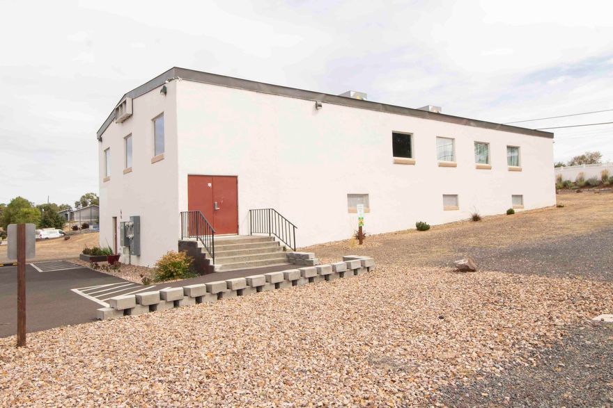 Prime Commercial Opportunity in the Heart of Madras.

6,400 SF building on Hwy 97 with excellent visibility and easy access. Situated on a large parcel with excess land. Formerly used as a church, the property allows for high-capacity uses and offers remarkable versatility—ideal for church, event venue, community hall, or other commercial ventures. 

The upper level features a stunning assembly hall with full-span wooden beams, wood floors, classroom/office, and restrooms. The lower level includes a large open room and a commercial kitchen, restrooms and a fireplace. Both levels have ground-level access due to hillside construction, providing flexible use and accessibility. Plenty of power available and a long list of upgrades.

A rare opportunity to own a high-profile property in a growing community with endless possibilities.