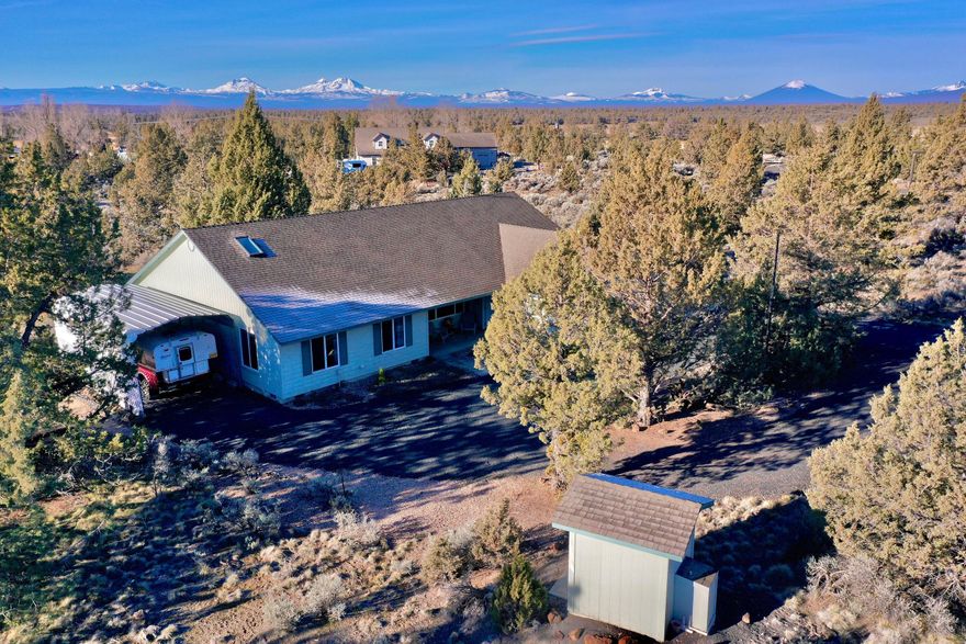 Great country property with a 3 bed 2 bath single level 1800 s.f. home on 5 Acres! These don't come up everyday especially with Mtn Views too! Very well cared for home with a light and bright open floor plan, Huge primary suite with access to the back deck. Wonderful layout for formal living and dining and a more relaxed area off the kitchen. The 3 car garage is huge and offers extra space for a person that likes to tinker. This neighborhood is just the nicest you will find in Central Oregon, neighbors looking out for each other! Don't wait, schedule a showing today!