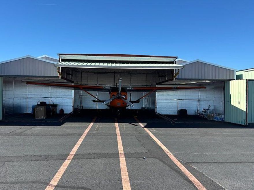 Rare opportunity to own a T-Hangar with direct taxiway access at the Bend Municipal Airport. Offered for sale is Hangar 63096-TA2. Please note that only the hangar is for sale—the aircraft inside is not included. This is the perfect time to purchase at the Bend Airport, as the new control tower is nearly complete, adding even more value to this prime location. The hangar measures approximately 41 feet wide by 33 feet deep, with an expanded wing area of 10 feet 6 inches wide by 16 feet deep, and a main hangar door opening of 19 feet wide by 33 feet deep. Listed at $98,900, this hangar is shown by appointment only.