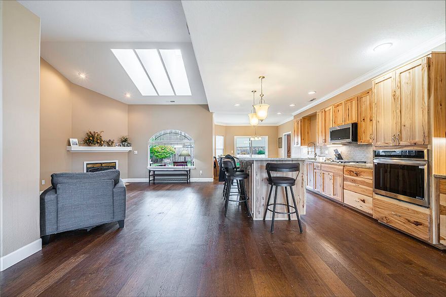 Completely remodeled Kitchen and living space! This single-story home offers the perfect blend of comfort and elegance. The 4th bedroom was converted into an office space or reading room. It can easily be converted back into a 4th bedroom. Nestled within the highly desirable Eagle Point Golf Community, the residence boasts an open-concept layout. The home is ideal for both relaxing and entertaining. The home flows seamlessly and has natural light throughout. A three-car garage provides plenty of room for vehicles, storage, or a workshop, and yes. your golf cart! Just minutes from the fairways, this home combines comfort living with the lifestyle only a golf community can offer.