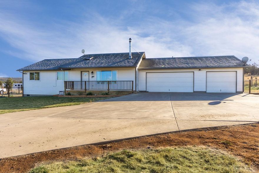 Turn Key Horse Property! Almost 3 acres property features 4 stall barn w/heated tack area & hot water to get through the winters. Cross fenced w/private well. Hay storage/machine shed to store more equipment and toys. 3bd/2ba home, 1288sqft, brand new paint inside and out! Open living area w/wood stove, hand scraped wood floor, tile floors & newer carpet. Kitchen has a full tile back splash & opens out to back porch. Fully finished, heated, 3-car garage. And the list goes on, a must see!