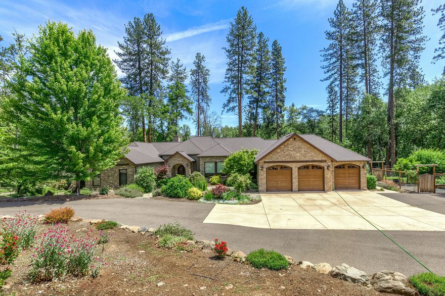 This Rogue River Estate is a luxurious property nestled on 6.46-acres along the banks of the Rogue River. The main house, built in 2012, offers 4-bdrms, 3.5-baths & spans 3,514-sq. ft. It features a coffered ceiling, tall floor-to-ceiling windows & two primary suites. The kitchen boasts granite countertops, Thermador appliances & a wine refrigerator. A fireplace adds warmth to the great room, while an office provides a private space. The enclosed back patio & attached 3-car garage are additional highlights. The estate also includes a guest house w/3-bdrms, 1-bath & 1,230-sq. ft. The property offers low bank river access, a gated entrance & irrigation from the Rogue River. It features a fenced garden w/raised beds & fruit trees, meticulous landscaping & a rolling lawn leading to the rivers' edge. There is also a detached 2-car garage, well, septic system & all-blacktop driveway. Too many amenities to list!