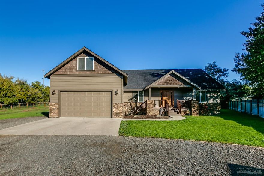 Turn key & situated on an oversized lot w/in city limits w/no CCR's or HOA! Fish in the Ochoco Creek at edge of property or enjoy summer picnic creekside. Builder's custom home w/great room layout w/3 bedrooms on main level & Bonus room or 4th bed over garage. Hand scraped wood floors w/Travertine details in entry hall, formal dining room, arched entry ways & premium finishes. Kitchen ft stylish granite counters, corner pantry & bfast bar. Open to living space & entertaining extends outside thru the French doors to deck & down to a new stamped concrete patio. Vaulted ceiling extends to the Master Suite w/walk in closet, tiled shower & comfortable jetted soaking tub. Two additional oversized bedrooms @ opposite end of house, Bonus/4th br above garage - fantastic movie/play room. Laundry room w/sink & extra storage. Forced air heat w/Central A/C, hot water circulating pump. RV parking & space for toys. Fully fenced w/ auto sprinklers, gated entry, brand new exterior paint. Don't Miss!<br