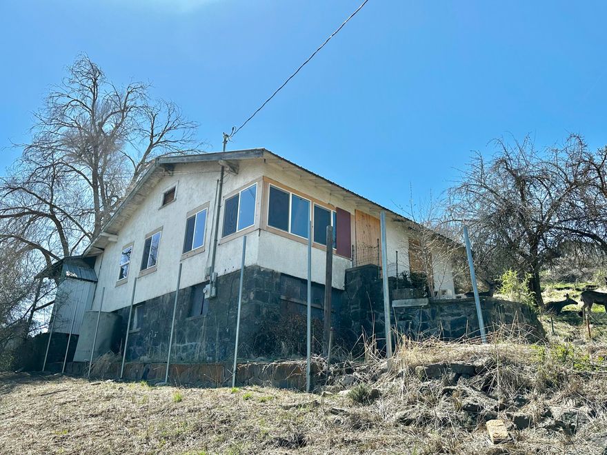 This home has a ton of potential for the right investor! Owner will carry eith acceptable down payment and terms. Bring your tools and your imagination to make this 3 bed, 2 bath home like new again. Some renovations have begun. The interior has been gutted and new windows are in. The home is not inhabitable, but with repairs, it could be legally inhabitable again.