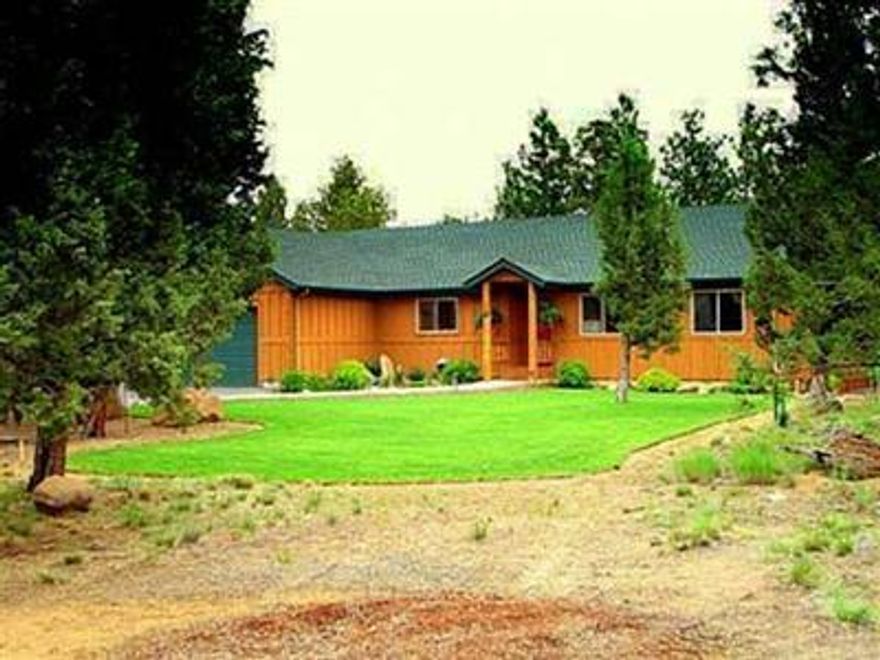 Immaculate single story, 2,041 sq.ft. home with three bedrooms, two baths on 4.88 acres in the Sisters School District. Flooring of seven blended woods, abundant windows and oversized rooms - combine to make this custom home a property to see. Trek deck and large patio with hot tub invite you to enjoy the naturally landscaped gardens; 24x32 shop with 12' door and bath. Easy access to Sisters, Bend and Redmond. Close proximity to U.S. Forest.