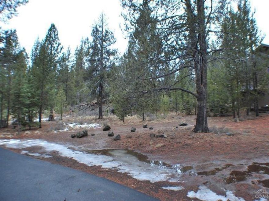 Spectacular Sunriver Lot. Great lot to build your Sunriver retreat. Unique rock out cropping enhances the beauty of this lot. Great location close to Fort Rock Park, SHARC, and The Village Mall. House next door is also for sale for a great opportunity to own both. Not many Sunriver lots left, Hurry!!