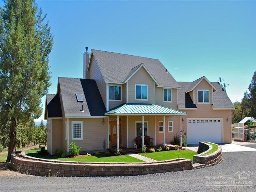 Gorgeous Custom House, 3.21 acres, 5,000 SQ.FT Shop w/Mother in Law Suite! What more could you need? This beautiful 2592 SQ.FT home, which features mstr. on main, expansive vaulted ceilings, open floor plan, large bonus room, wood trim & doors, upper & lower decks & views. The 5,000 SQ.FT Shop features radiant in-floor heating, shop bath w/shower. The mother-in-law suite offers a separate entrance, 2 bed, full bath, kitchen, dining area & living room* The apt cannot be used as a 2nd dwelling or rental!