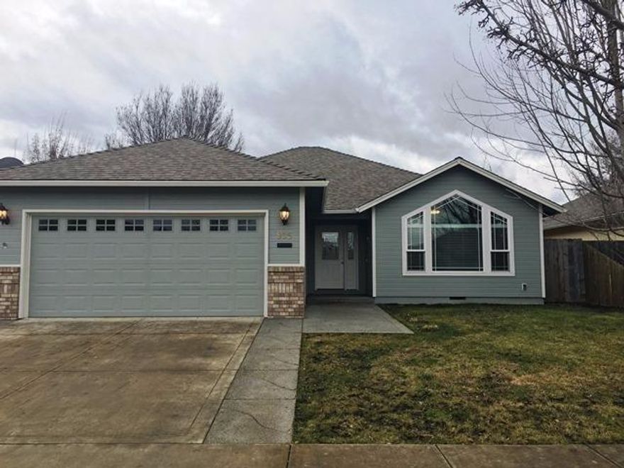 A great price in a great neighborhood. This 3 bedroom, 2 bath, 1517 sq ft home features great room floor plan with vaulted ceiling and large picture window, nice kitchen with eating bar open to the dining room, glass top range, over the counter microwave, arched doorways, laminate flooring throughout with tile in the bathrooms, laundry has built in sink and tile flooring. There is a spacious master suite with walk-in closet and closet organizers, double sinks and bath/shower. Backyard includes covered patio, concrete patio with space for a fire pit and lawn area. Tons of storage in the 2 car garage. Close to shopping. Don't miss this one!