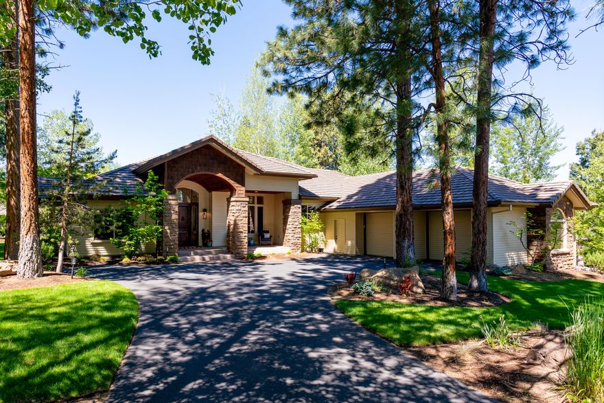 Updated SINGLE LEVEL Northwest style home on large lot backing to greenspace in beautiful golf course community of Broken Top. Great room with 14' high ceilings, new stone fireplace surrounded w/barn wood built-ins & hardwood floors. Wall of windows allows ample natural light with views to the deck, greenspace & seasonal cascade mountain views. Gorgeous remodeled kitchen w/wood beams, large island, dining area with built-in seating, new cabinets, slab granite counters, new high-end appliances include Thermador range/dishwasher, Bosch fridge, microwave drawer & wine fridge. Dining room repurposed as 2nd office. Primary bedroom wing includes office w/cherry built-ins, laundry room with sink, bath with dual sinks, jetted tub, separate shower & walk-in closet. 2 guest bedrooms with Jack & Jill bath on opposite end of home. Flex room used as workout area. All new carpet and lighting. Large 902 sq. ft. garage.  Close to westside amenities & downtown.