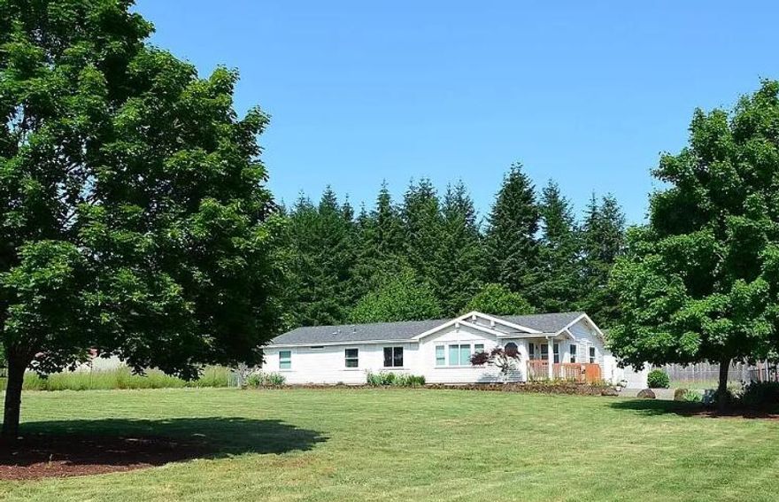 Open House from 11 to 2 this Saturday!  Open House Special... Seller offering $24,000 toward buyer's interest rate buydown. Could be up to a 1% lower rate!!  Courtesy to Brokers! Quick close possible with seller relocating for business—this beautifully maintained 3-bed, 2-bath Peaceful Acre Retreat boasts 1,760 sq. ft. of open living with vaulted ceilings, skylights, solar tubes, and a smart split floor plan on a level, fully fenced acre with no easements. Privately tucked away on a flag lot yet just half a mile from local favorites like Kissin' Kate's, Red Barn Country Store, Creek Coffee, Taqueria Jalisco, and Beavercreek Grocery, it perfectly blends rural charm with everyday convenience. Recent upgrades include new flooring, low-E windows, 2021 HVAC, and a modern kitchen with all-new stainless steel appliances, premium induction cooktop, RO water system, and refrigerator—plus a versatile shop with 11.5' garage door for all your projects!!