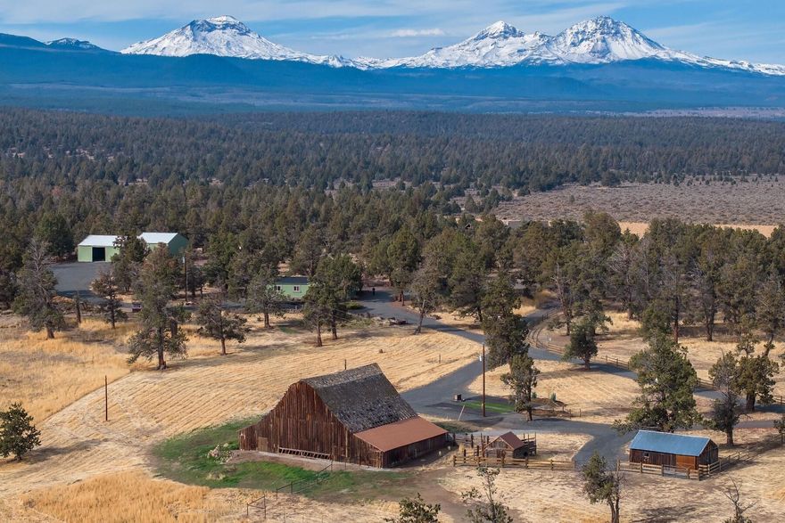 Stunning Cascade Mountain Views from home/potential home site on 17.4 acres in Tumalo. Property includes: finished heated shop with 2 attached bays, historic barn, blacksmith shop, two RV hookups, new well, detached garage with 2 storage rooms/office, fenced paddocks for livestock and public land across the highway. Elevated building site is approved with Deschutes County for a replacement dwelling, sits off the highway and has unobstructed mountain views. Country Home is well maintained, 2340 sq ft, open floor plan with dining area, living room, utility room, single level, new roof and covered porch. Wonderful opportunity for any Central Oregon lifestyle.