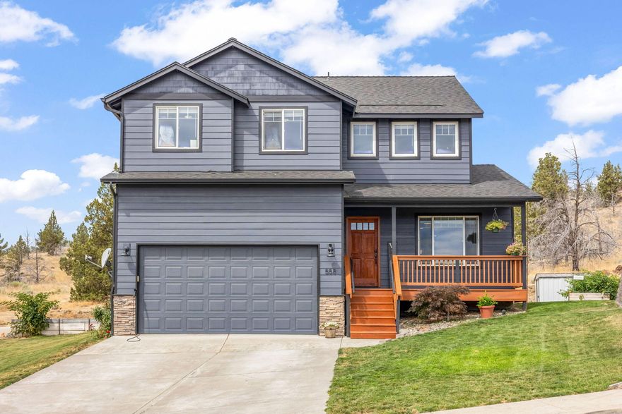 Perched on a hill with sweeping easterly views, this 1,894 sq. ft. custom home offers style, comfort, and thoughtful design. Featuring 3 bdrms, 2.5 bths, separate living & family rooms, and a kitchen made for gathering—pantry, center island, breakfast bar, stainless appliances, and rich cabinetry. The family room invites you in with a cozy propane fireplace, built-ins, and soaring vaulted ceilings opening to the loft. Upstairs, the spacious primary suite boasts a walk-in closet, dbl sinks, garden tub, and separate shower. All-new LVP/laminate flooring, fresh interior & exterior paint, brand-new 2024 roof, large entertaining deck, newer sink & stove, and new tile in the primary bath add modern comfort. On a corner lot with a double garage, this move-in ready home is where charm meets updates—perfect for creating lasting memories.