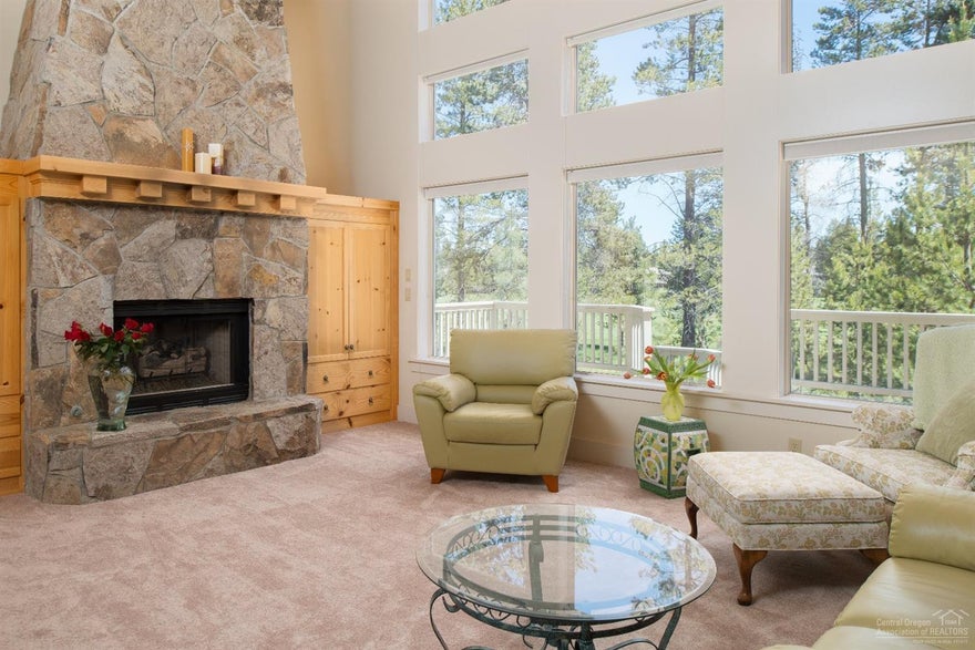 Golf course views in great location. Enjoy this spacious home that was built to last. Open great room w/a wall of windows for natural light & gas fireplace; flows into dining areas & kitchen. Kitchen features access to upper deck, tile counters and pine cabinets. Enjoy the large master suite w/vaulted ceilings, deck access & en-suite bath w/soaking tub. Upper loft is perfect spot for office. Downstairs has beautiful bedrooms and space in-between for family entertainment.