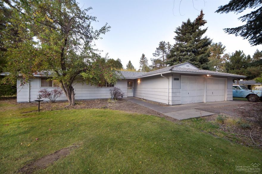 Charming single level home in an established SE Bend neighborhood with zero steps. This home is framed by large pine trees on a generous size lot with plenty of space for RV parking. A guest cottage with a full bathroom sits at the back of the property and provides a unique opportunity to house friends or family. Stainless steel appliances and free standing gas fireplace. Fenced and landscaped yard with mature fruit trees and a sprinkler system. Convenient location provides easy access to all of Bend.