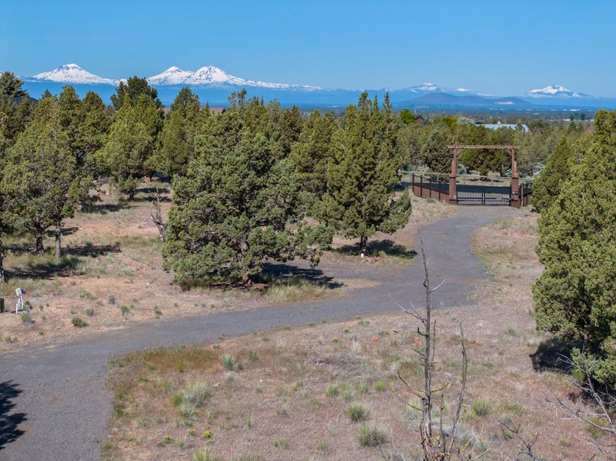 This exceptional 5 acre lot in Mountain View Estates offers the perfect location for your custom home with Cascade Mountain and Smith Rock views. The lot is flat with Juniper trees, in quality neighborhood with paved streets and buried utilities. The property is ready for construction with Avion water (including a frost-free spigot), CEC electric (400-amp service), and an approved cap and fill septic system. The lot is fenced, private and has solar-powered entrance gate with a keyless pad. Metal storage shed is 10x25 with a concrete foundation. Bring your builder and discover the potential of this unique property!