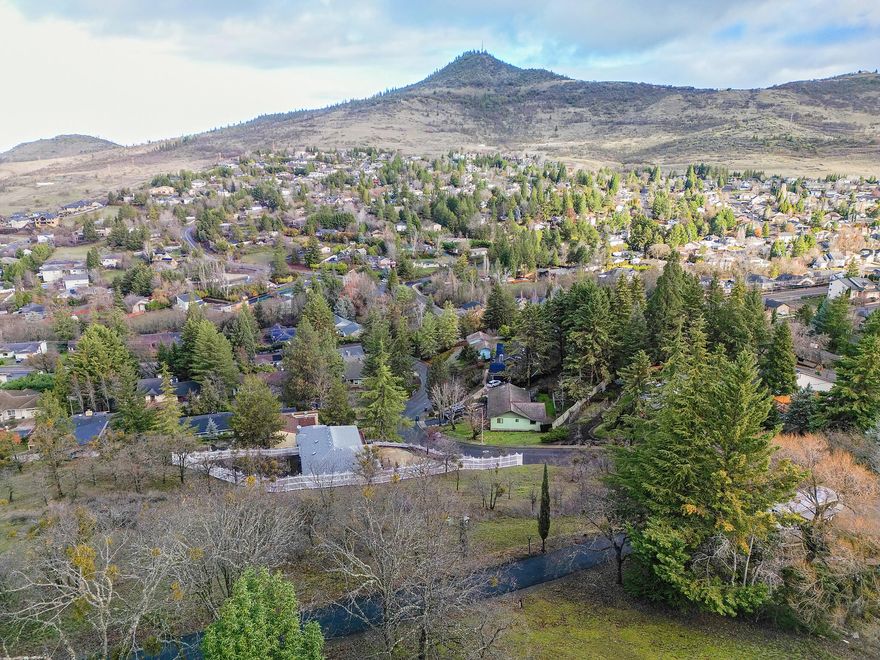 Gently sloping lot nestled among established, mature trees in a highly desirable East Medford
neighborhood. This parcel offers a beautiful view of the valley, mountains and sits among well kept homes with no
HOA restrictions. All utilities are conveniently located at the lot line, making it an excellent site
for future construction. A rare opportunity to build in a sought after, long established community.