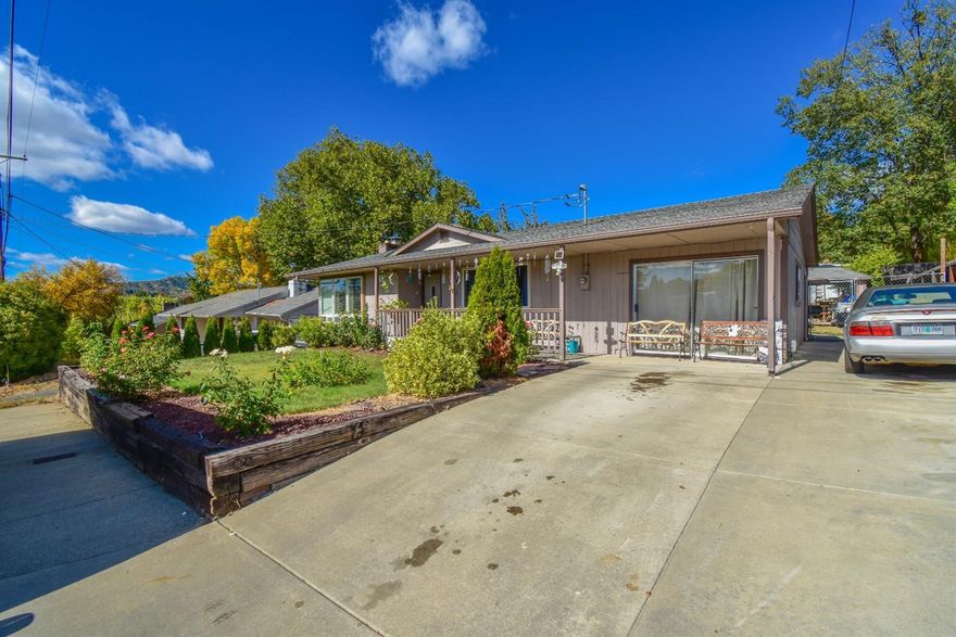 Nicely updated 4 bed 2 bath home on large lot. This home features new bamboo flooring, travertine tile wainscoting, mew recessed can lighting with dimmers and updated vinyl windows throughout. There is a large formal dining space with a large picture window, the kitchen features new custom cabinets and counters, dual ovens and a large island. Large rooms and conveniently placed restrooms with plenty of storage. Large back and side yards include a storage shed, RV parking and mature plants provide all the privacy you could want. Garage has been converted to additional room can be used as studio or office space.