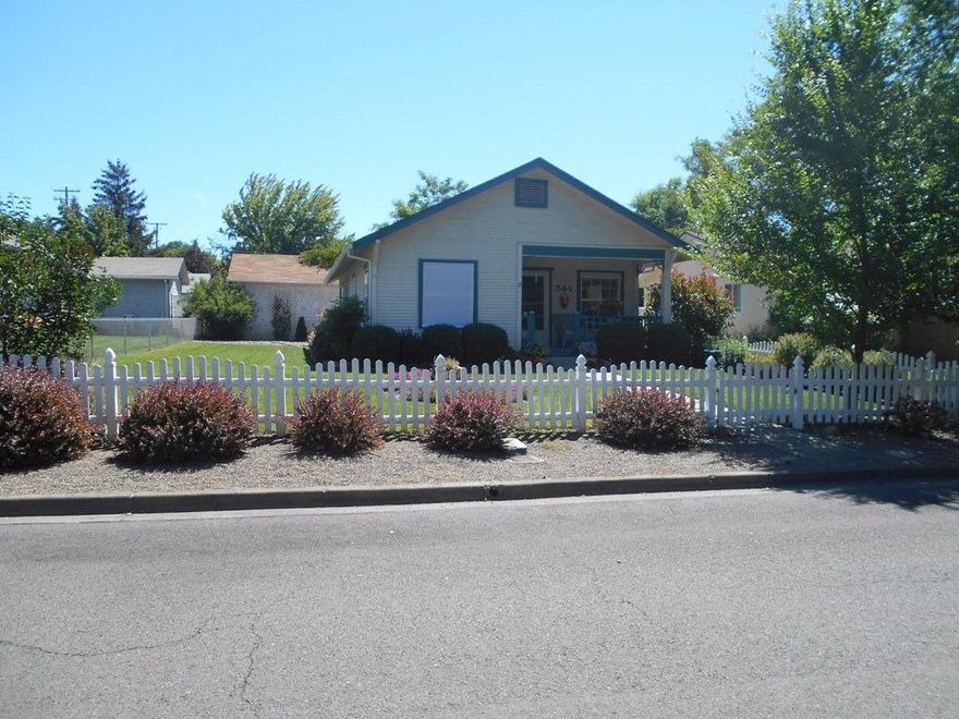 This Cottage home sits in well-developed East Medford neighborhood. Nice manicured Landscaping with a cute front porch. This home has been well maintained simple floor plan, High ceiling, lots of storage, The kitchen is very open with many cabinets. The backyard has a very nice patio with pergola. Back Alley Access with two car parking and a detached 15 x 16 Workshop.