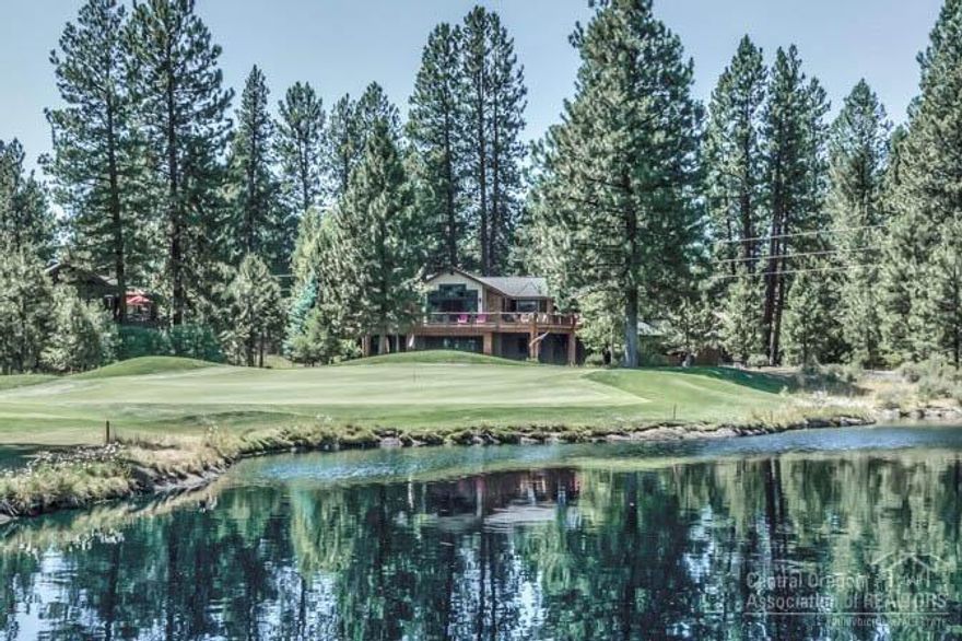 This beautiful showcase home is on the first page of the Widgi Creek website. The home is perched on the back of the 6th hole and overlooks the lakes on this hole and the green. Reversed living with relaxing views from upper and lower decks. Featuring 3 Master suites, downstairs living/family room, 3 gas fireplaces, gourmet kitchen with 6 burner gas range, two stainless steel refrigerators, two dishwashers, granite slab counter tops, bay window dining area, 3 car & 1 cart garage, distressed Maple hardwood floors, antiqued cabinets, steam shower, floor to ceiling rock fireplace in great room, walk in pantry.